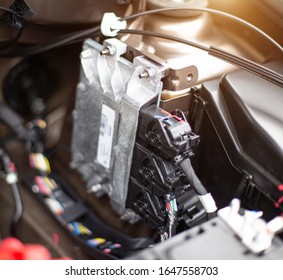 The Electronic Engine Control Unit Of The Car Installed In The Engine Compartment. Car Software