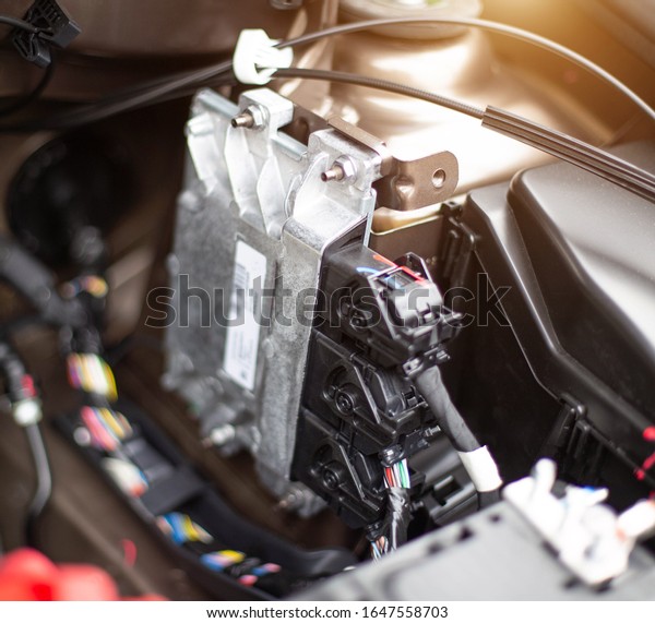 The electronic engine control\
unit of the car installed in the engine compartment. Car\
software
