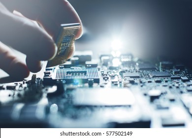 Electronic engineer of computer technology. Maintenance computer cpu hardware upgrade of motherboard component. Pc repair, technician and industry support concept. - Shutterstock ID 577502149