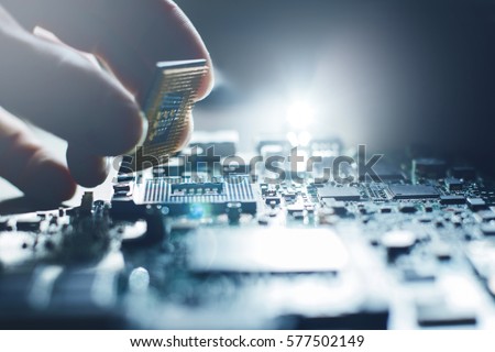 Electronic engineer of computer technology. Maintenance computer cpu hardware upgrade of motherboard component. Pc repair, technician and industry support concept.