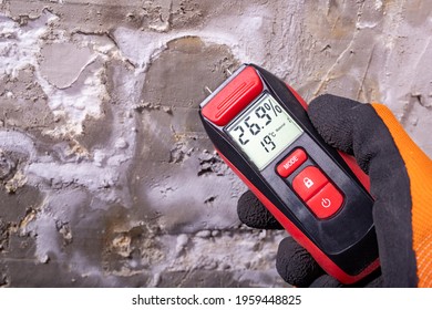 Electronic hygrometer for taking measurements. Accessories for determining the moisture content of building materials. Light background. - Shutterstock ID 1959448825