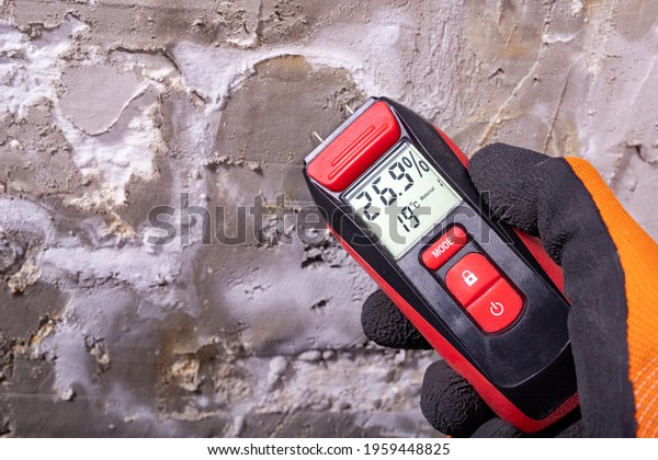 Electronic hygrometer for taking\
measurements. Accessories for determining the moisture content of\
building materials. Light\
background.