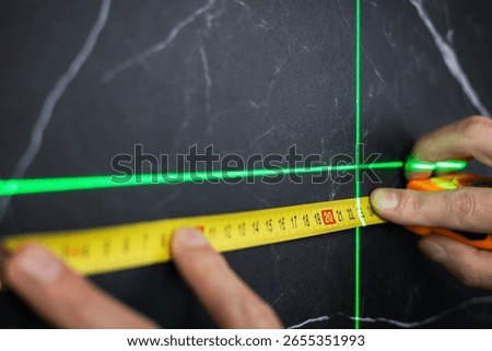 Electronic laser for checking angles and straight lines during measurements.