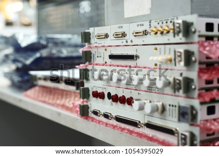 Electronic modules and electronic cards stacked in a stack. Warehouse production of electronic devices.