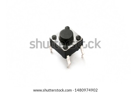 Electronic momentary push button switch on white background