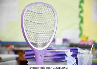 Electronic Mosquito Swatter In The Office Room For Killing Mosquitoes And Insects Inside The Office, Soft And Selective Focus.