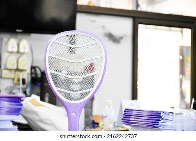 Electronic Mosquito Swatter In The Office Room For Killing Mosquitoes And Insects Inside The Office, Soft And Selective Focus.