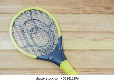 Electronic Mosquitoes Killer Swatter  On  Wooden Background