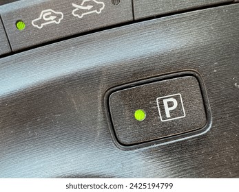 Electronic parking P symbol in automatic transmission vehicle closeup.