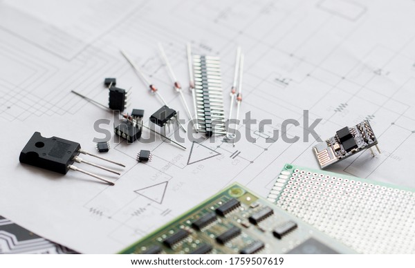 Electronic parts on the background of the\
schematic diagram. Diodes, microchips, transistors, integrated\
circuits, capacitors.Design of electronic circuit and electronic\
Board.Connection\
diagram