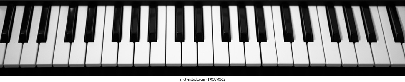 Electronic piano keyboard. Closeup of black and white piano keys - Powered by Shutterstock