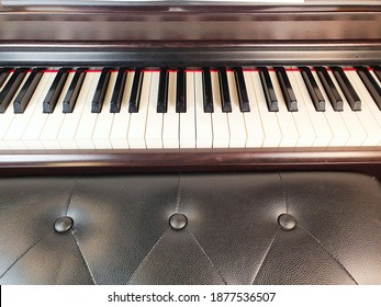 Electronic Piano Keys, Behind A Leather Banquette, Close-up, Selective Focus