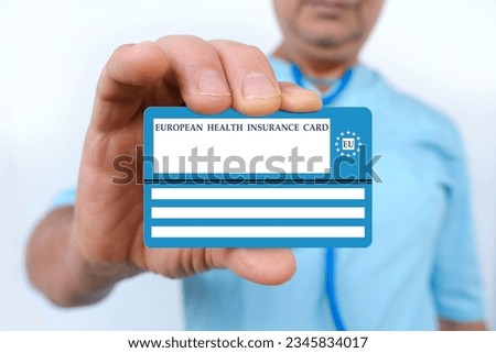electronic public health insurance cheaper, Insurance Card EU in male doctor's hand, concept medical support on trip to Europe, emergency treatment services, healthcare coverage abroad, card security