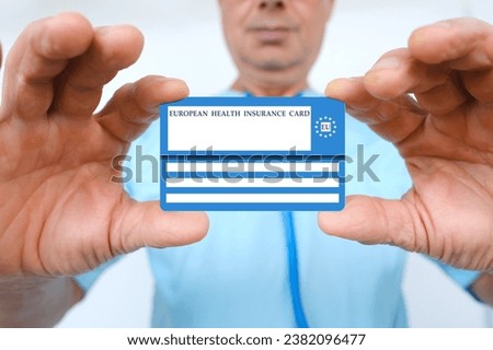 electronic public health insurance cheaper, Insurance Card EU in male doctor's hand, concept medical support on trip to Europe, emergency treatment services, healthcare coverage abroad, card security