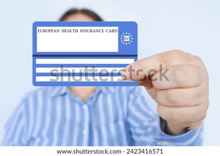 electronic public health insurance cheaper, Insurance Card EU in female hand, concept medical support on trip to Europe, emergency treatment services, healthcare coverage abroad, card security