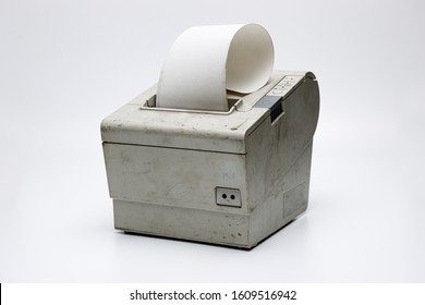 Electronic Recipe Printer With Paper Roll, Old And Used Printer On White Isolated Background With Dirt And Grunge, Connected To A Cash Register