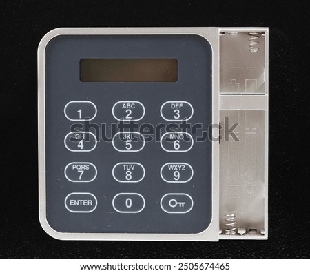 Electronic safe display. White and gray Safe keypad isolated on black background, Key pad of white digital electronic safe, with empty battery compartment.