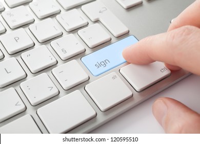 Electronic Signature Concept. Man Press Sign Key On Computer Keyboard.