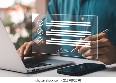 Electronic Signature Concept, Electronic Signing Businessman signs electronic documents on digital documents on virtual laptop screen using stylus pen. - Shutterstock ID 2129892098