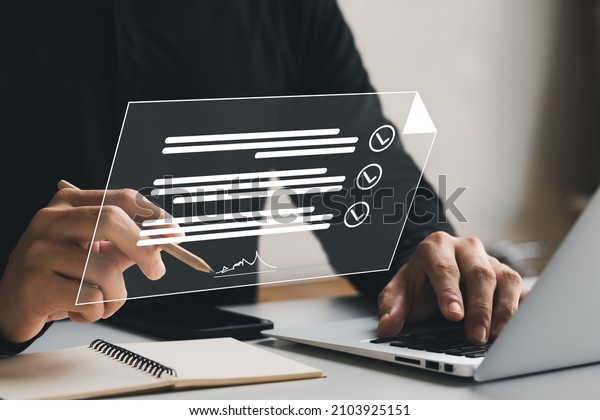 Electronic Signature Concept, Electronic\
Signing Businessman signs electronic documents on digital documents\
on virtual laptop screen using stylus\
pen.