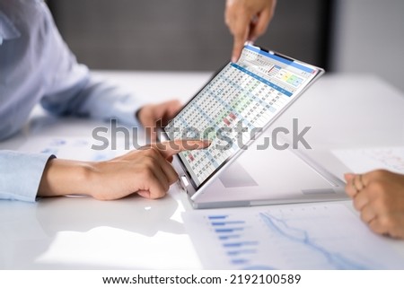 Electronic Spreadsheet Analyst Or Auditor Using Software On Hybrid Laptop