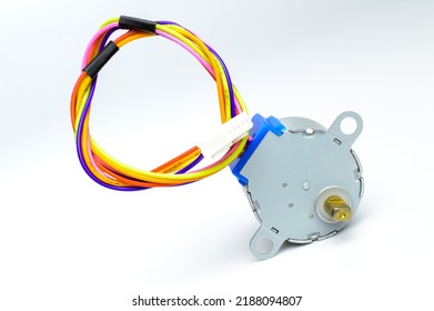 Electronic stepper motor with colorful wires on a white background. Macro photo. Background picture.