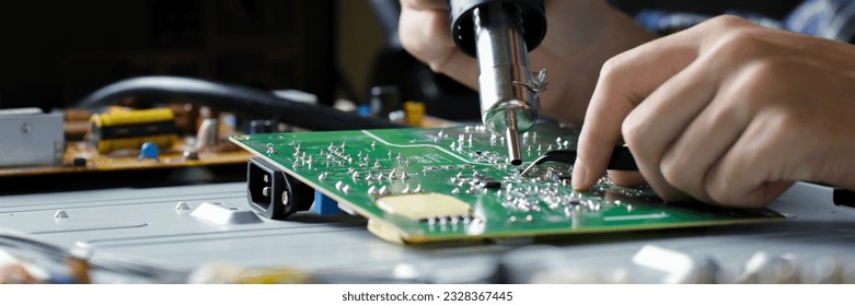 
electronic technician,banner, hands repairing electronic devices The use of modern one-stop service center concepts. - Powered by Shutterstock