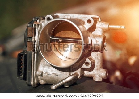 Electronic throttle body and engine bay background. Service and repair.