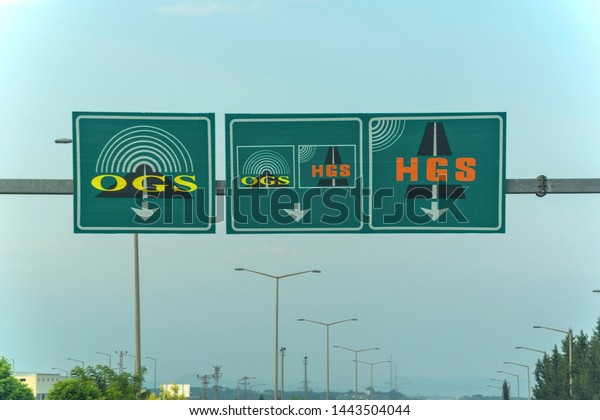 Electronic toll collection system signs on\
highway of toll road  in Adana Province of Turkey country, outdoor.\
07/05/2019
