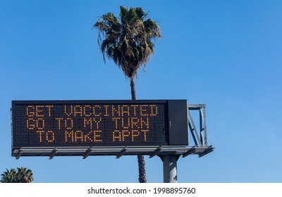 Electronic Traffic Sign With Message About Getting Vaccinated Against COVID-19 