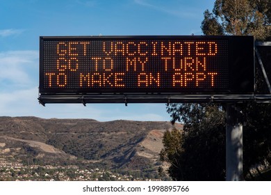 Electronic Traffic Sign With Message About Getting Vaccinated Against COVID-19 