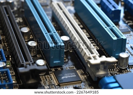 Electronics Components on a Modern PC Computer Motherboard with PCI and PCI-Express slot.