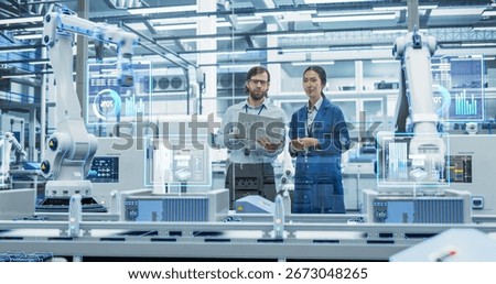 Electronics Factory Assembly Line Digitalization: Automated Robot Arms Manufacturing Advanced Equipment. Managers Discussing Work while Futuristic AI Computer Vision Analyzing, Scanning Conveyor Line