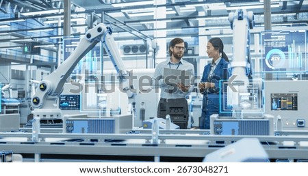 Electronics Factory Assembly Line Digitalization: Automated Robot Arms Manufacturing Advanced Equipment. Managers Discussing Work while Futuristic AI Computer Vision Analyzing, Scanning Conveyor Line