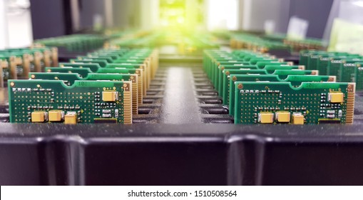 Electronics Manufacturing Services, Assembly Of Circuit Board arrangement, close-up of the raw of PCBA in tray.
