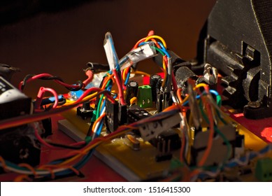 Electronics and robotics of handmade. Microcircuits and colored wires close up. Electronic devices and mechanisms are presented at the scientific exhibition.