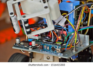 Electronics and robotics of handmade. Microcircuits and colored wires close up. Electronic devices and mechanisms are presented at the scientific exhibition.