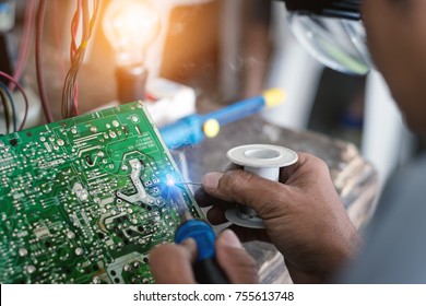 Electronics technician checking circuit board failure for correct repair.This helps to know the voltage of the circuit board..Digital Multimeter Electronic Clamp Meter.
 - Powered by Shutterstock