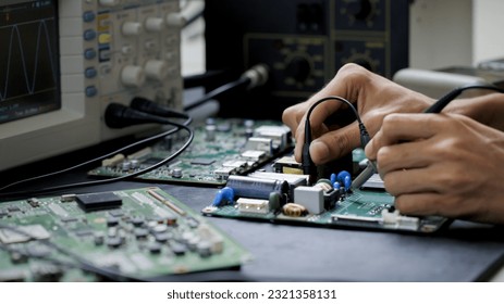 Electronics technician, electronic engineering electronic repair,electronics measuring and testing, repair and maintenance concepts.