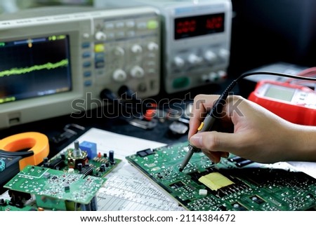 Electronics technician, electronics measuring and testing, repair and maintenance concepts.