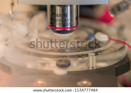 Electrophysiological setup with a microscope to record neurons in brain samples and cell cultures, details, closeup, direct light