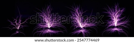 Electrostatic Discharge of Tesla Coil. set of bright electric lightning emanates from electric coils in the dark