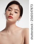 Elegance and Beauty - Portrait of a Woman with Radiant Skin, Glossy Lips, and Soft Makeup, Capturing Sophistication and Grace in Minimalist Style.