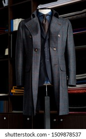 Elegance Bespoke Winter-coat With Suit, Brown Tie And Navy Blue Shirt On A Mannequin. Men's Clothing.