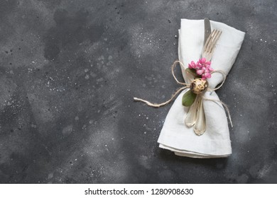 Elegance table setting spring pink hyacinth flowers on with pink linen tablecloth. Easter romantic dinner. Top view.