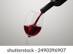 Elegance of tasty Red Wine Pouring into a glass,