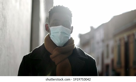 Elegant African Man Walking Outside Wearing Covid Surgical Face Mask