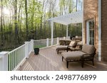 Elegant Backyard Deck With Lounge Chairs And Pergola In A Forested Area