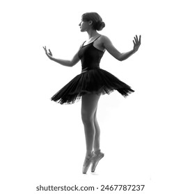 Elegant ballerina. A young graceful ballet dancer, dressed in pointes shoes demonstrates her dance skills. Power and refinement of classical ballet. - Powered by Shutterstock