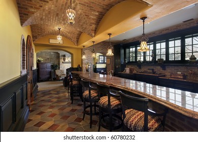 Elegant Basement Bar And Stools In Luxury Home